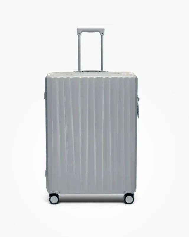 Nudient Bold Check-in L valigia Urban Grey rigida leggera