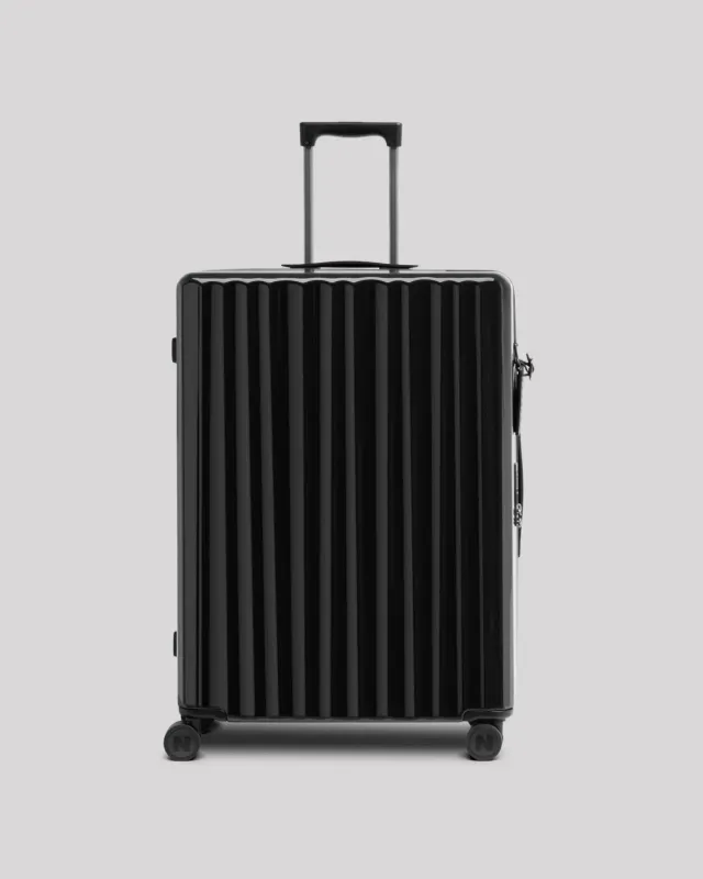 Nudient Bold Check-in V2 valigia L Charcoal Black leggera